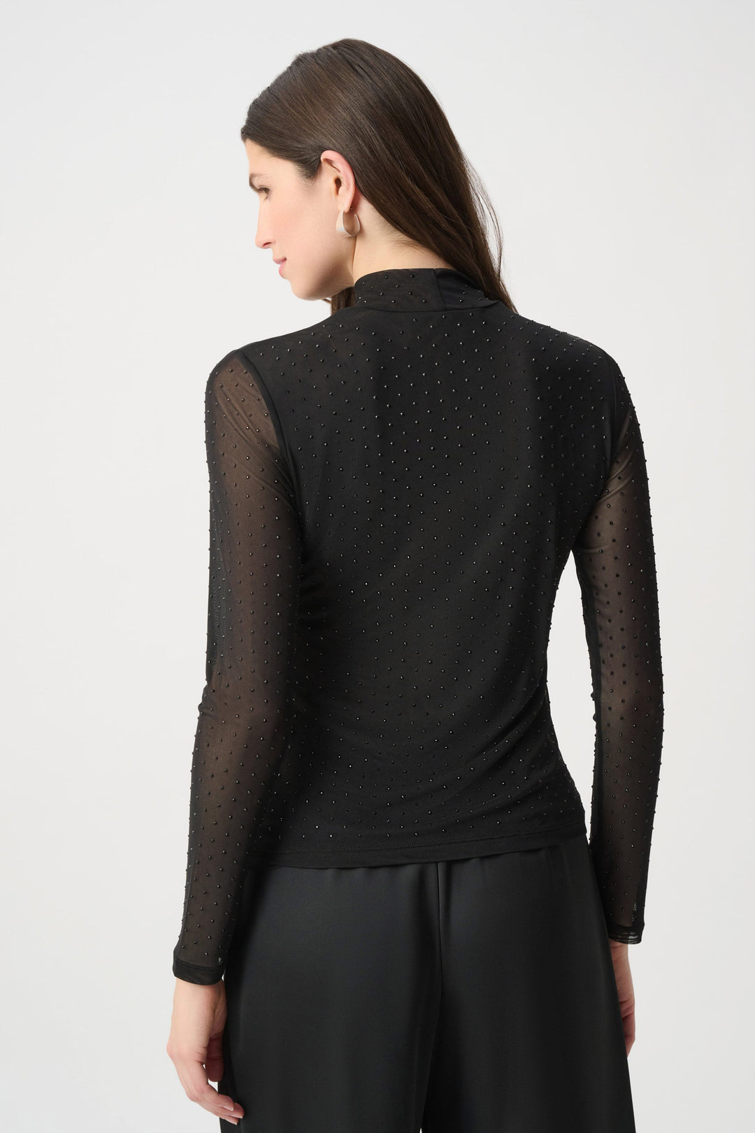 Black back view mesh top with long sleeves and rhinestone dot pattern
