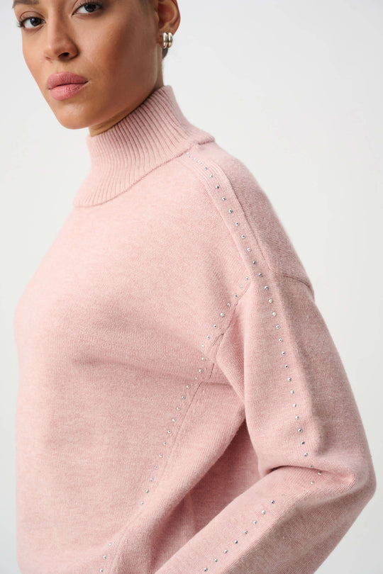 Soft blush embellished turtleneck sweater with studded shoulder accents and sleeve