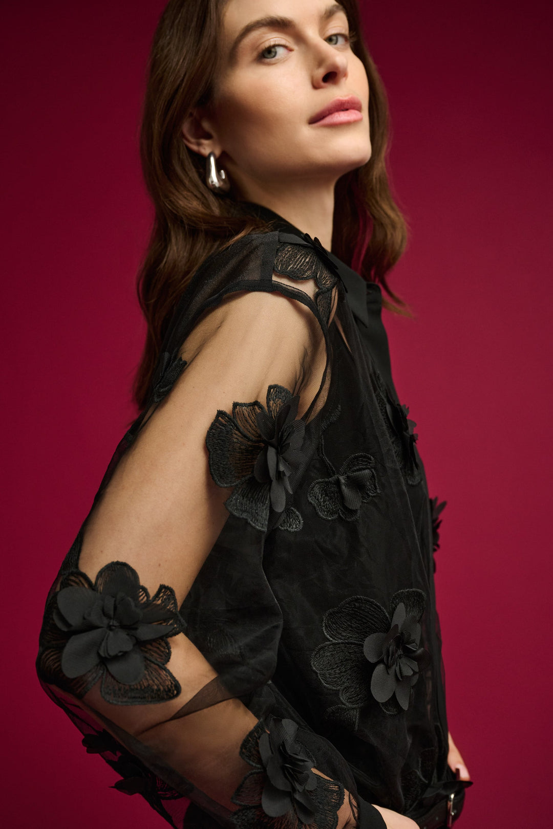 Joseph Ribkoff sheer black blouse with floral appliqué and sheer sleeves