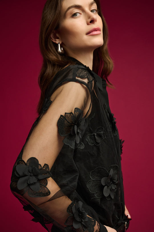 Joseph Ribkoff sheer black blouse with floral appliqué and sheer sleeves