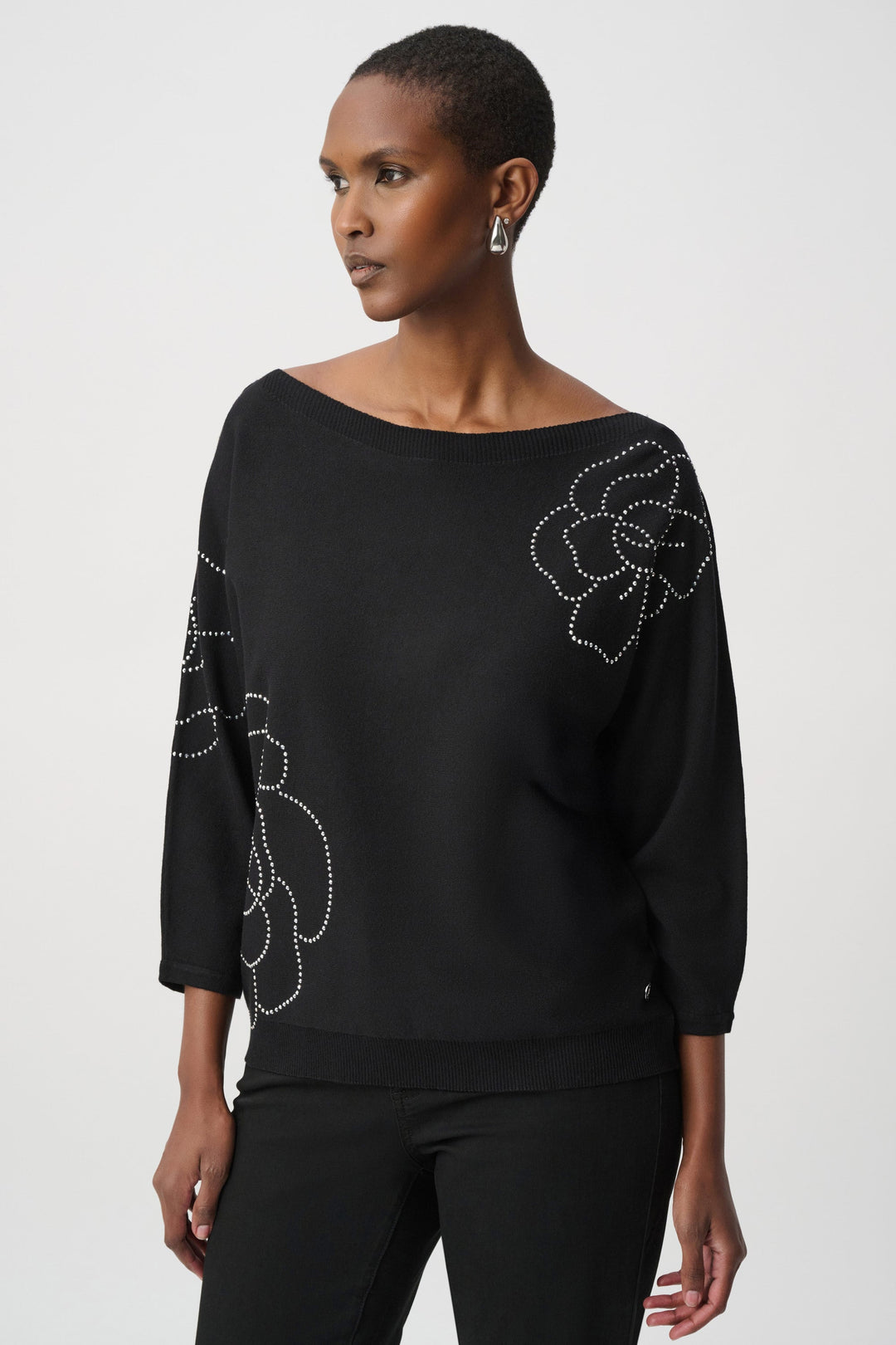 Black pullover sweater with three-quarter sleeves and rhinestone flower appliques