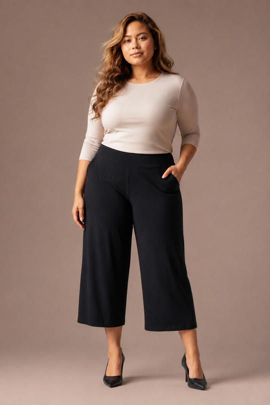 Black wide-leg cropped pants with front crease and slanted side pockets