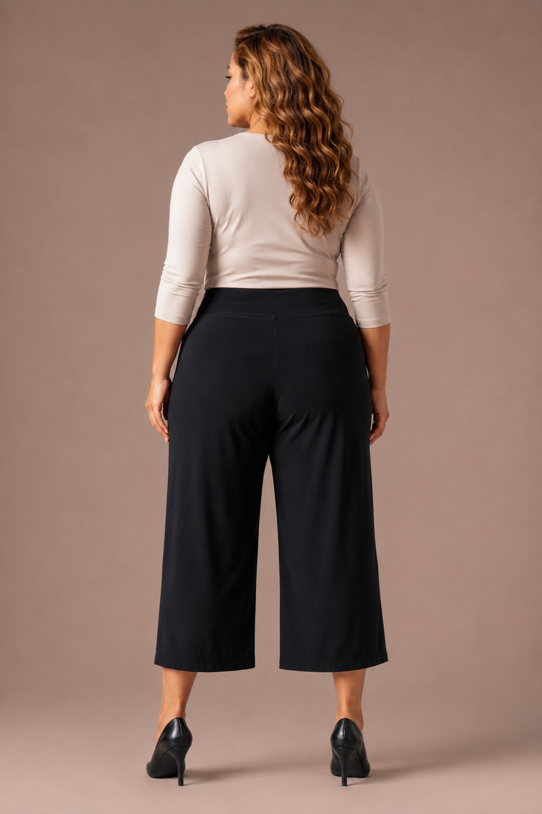 Black wide-leg cropped pants, back view with relaxed fit and center seam