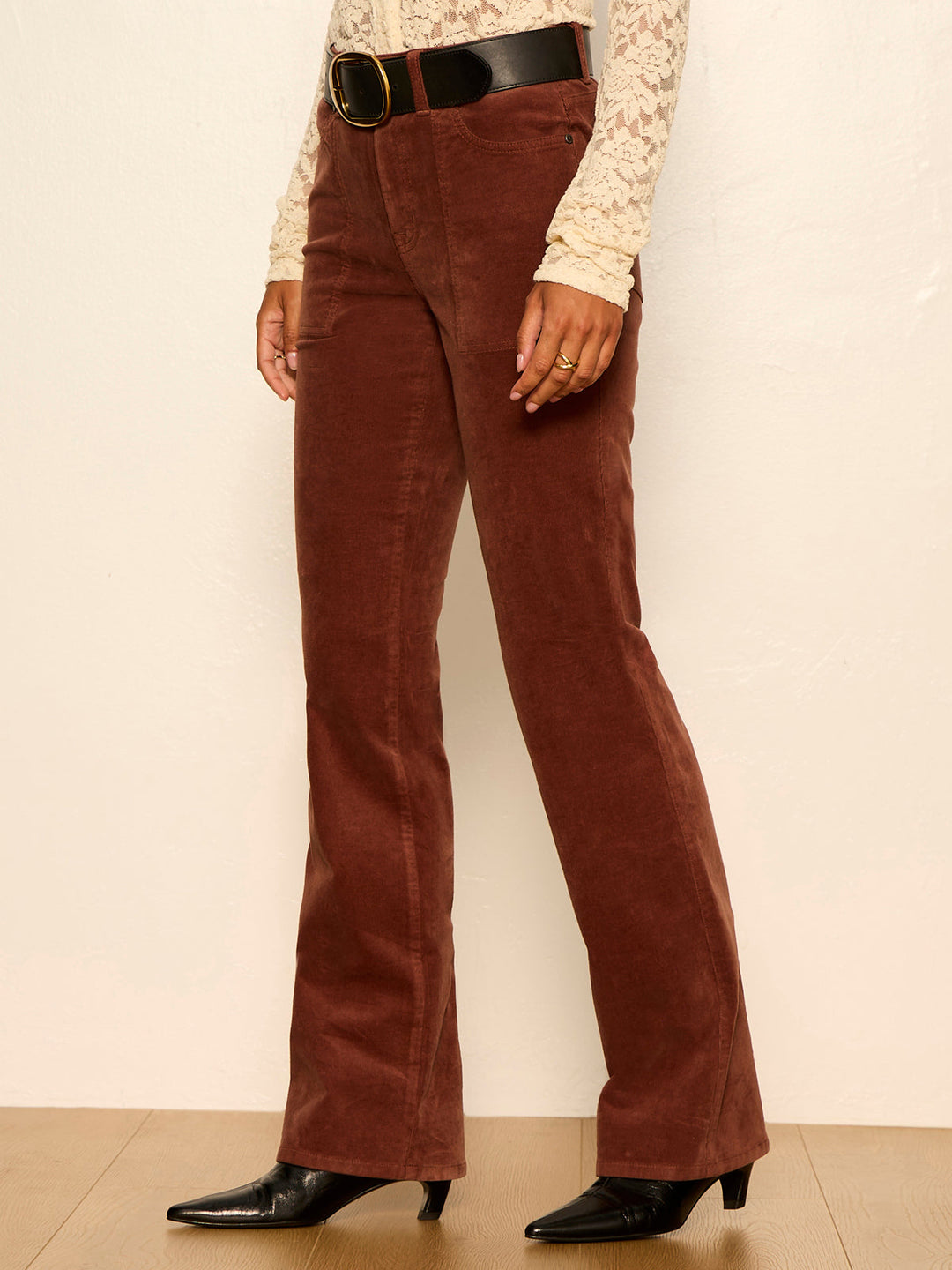 Burnt cocoa bootcut jeans with curved front seams and side pockets