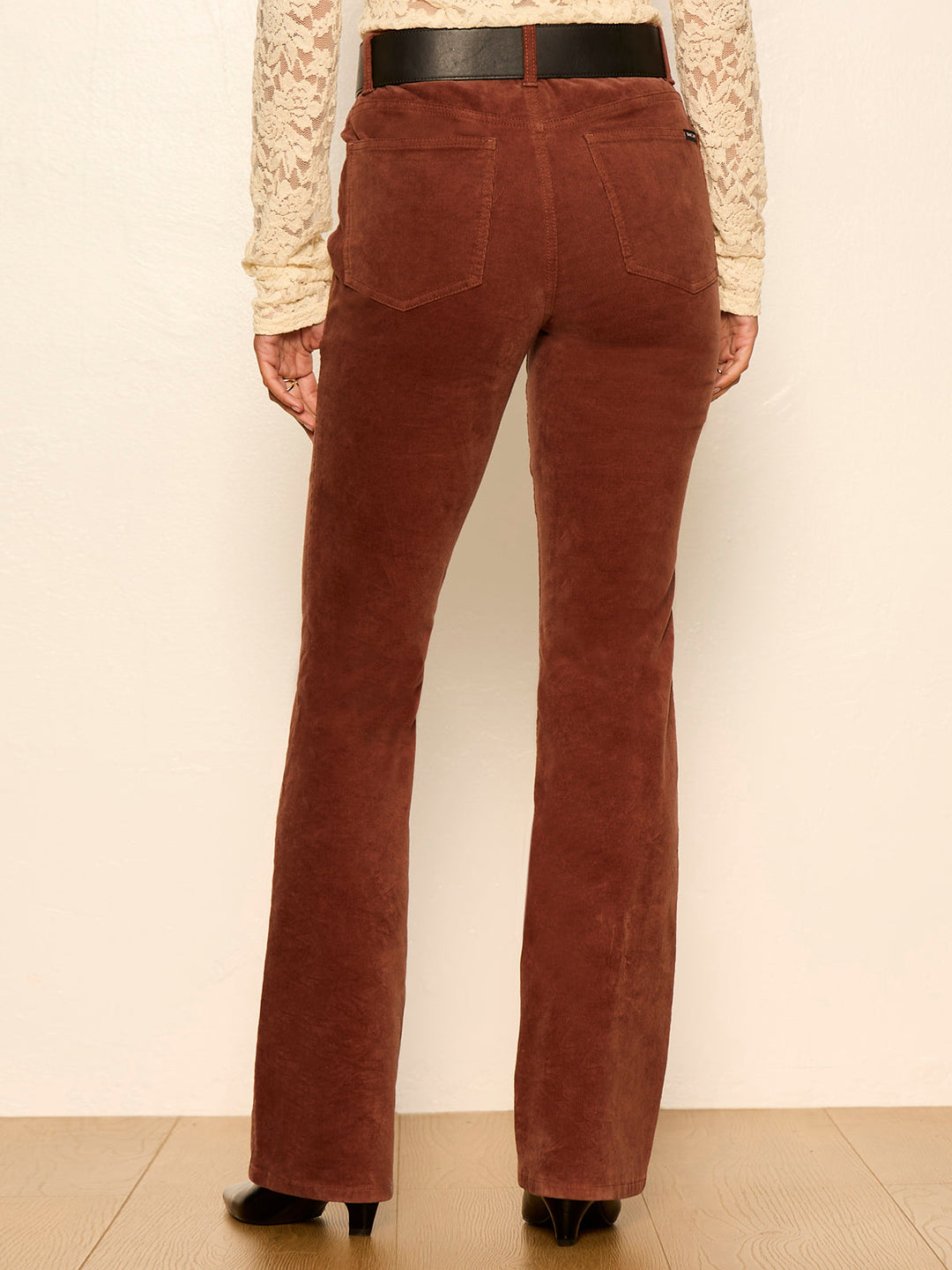 Burnt cocoa bootcut jeans with back yoke seam, belt loops, and flared hem