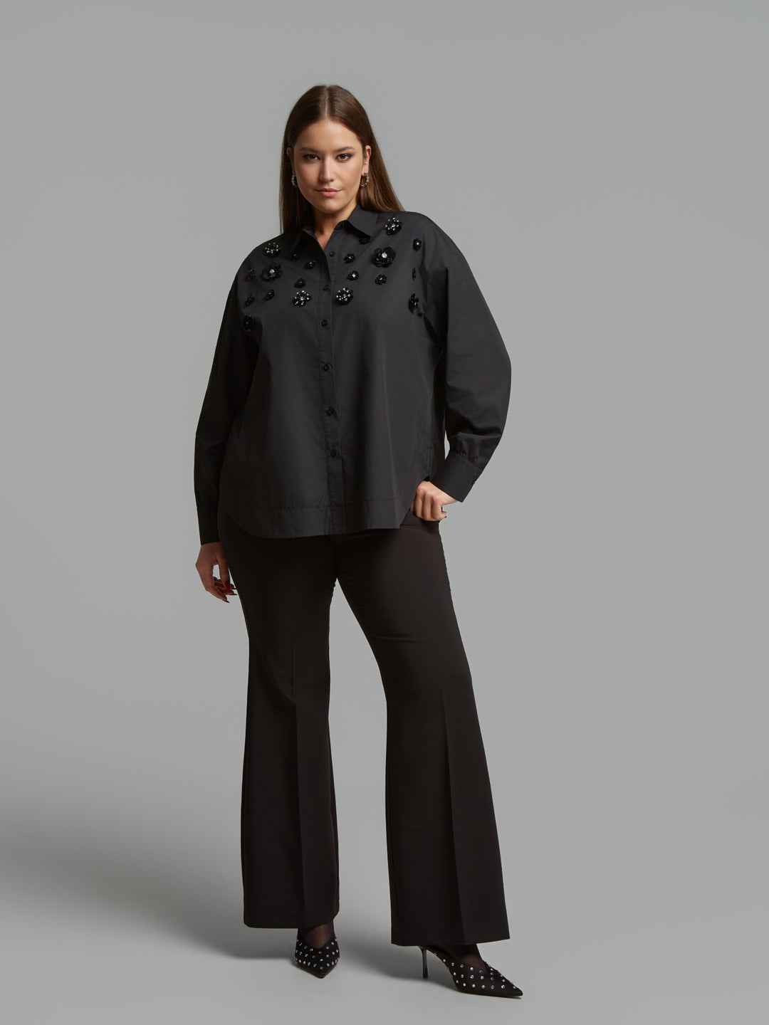 Black long-sleeve button shirt with stand collar and jet bead clusters on front