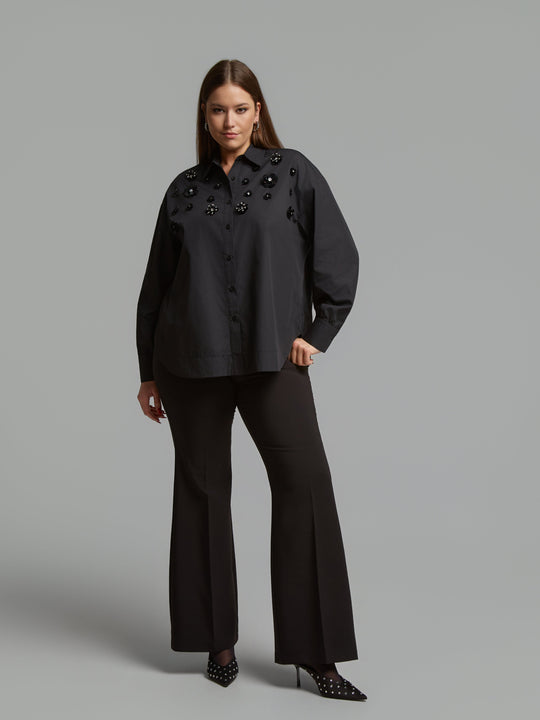 Black long-sleeve button shirt with stand collar and jet bead clusters on front