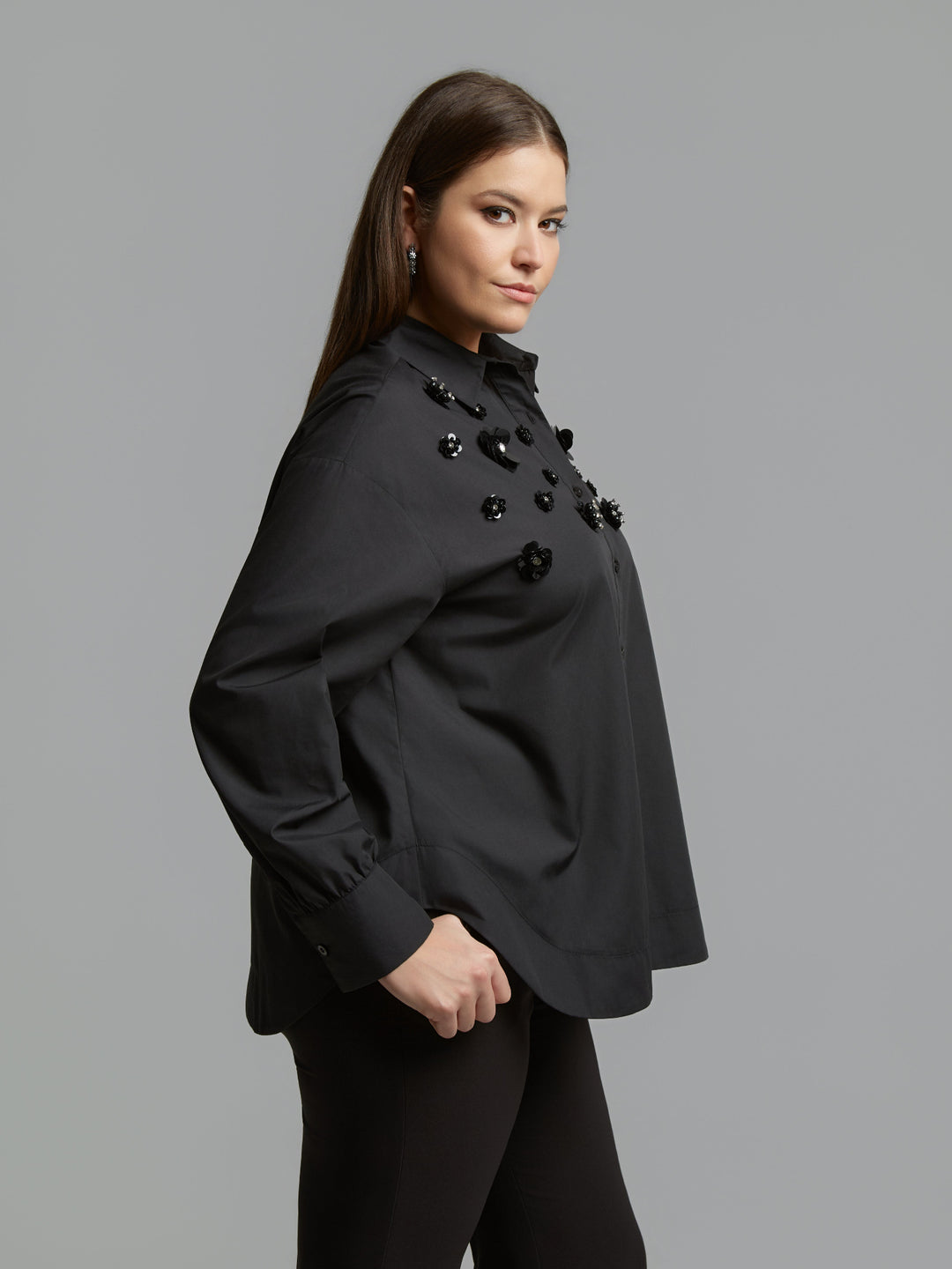 Black long-sleeve button shirt side view with black jet beaded cluster accents
