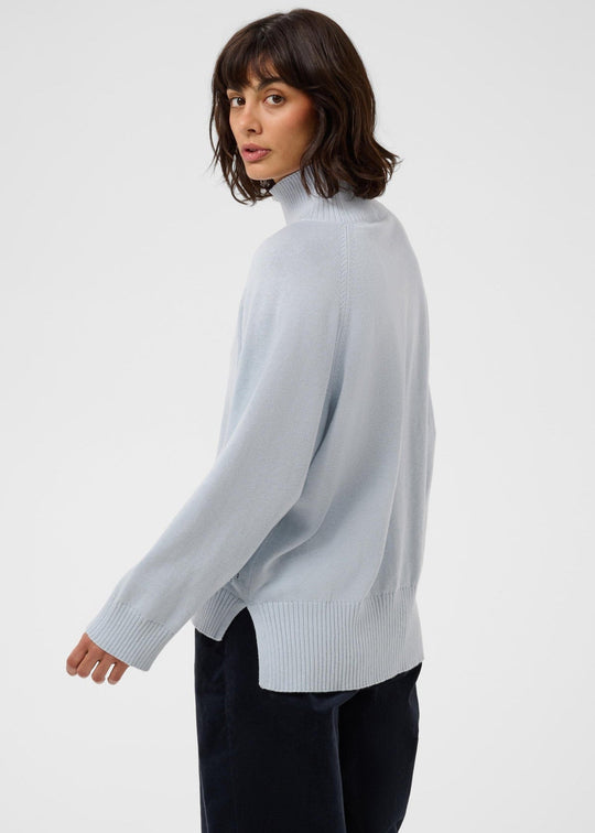 Light gray ribbed turtleneck long-sleeve pullover, side profile