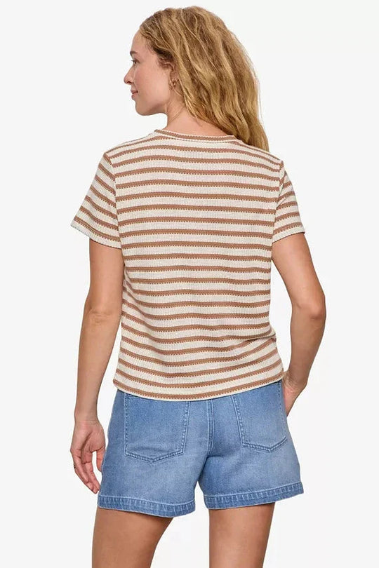 Brown and white striped short sleeve tee worn by model, back view showing textured fabric