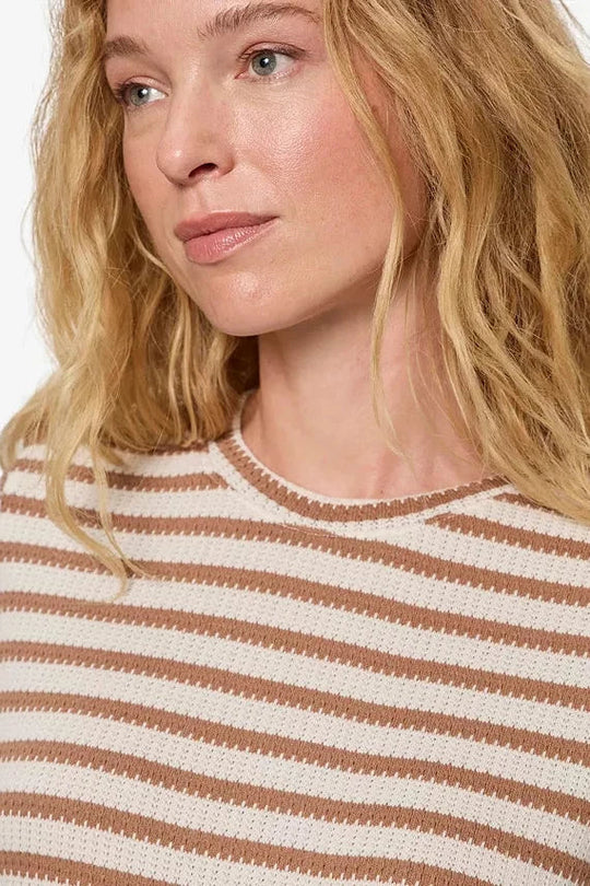 Short sleeve striped knit top with brown and cream horizontal stripes worn by model
