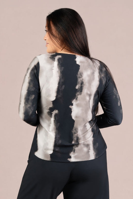 Back view of relaxed fit long-sleeve crewneck tee with abstract graphite watercolor print