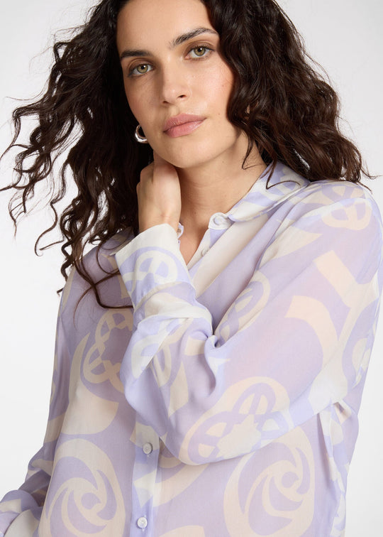 close up front view of plus size Elena Miro Menswear Inspired Long Sleeve Shirt on Logo Print in Lilac Milk