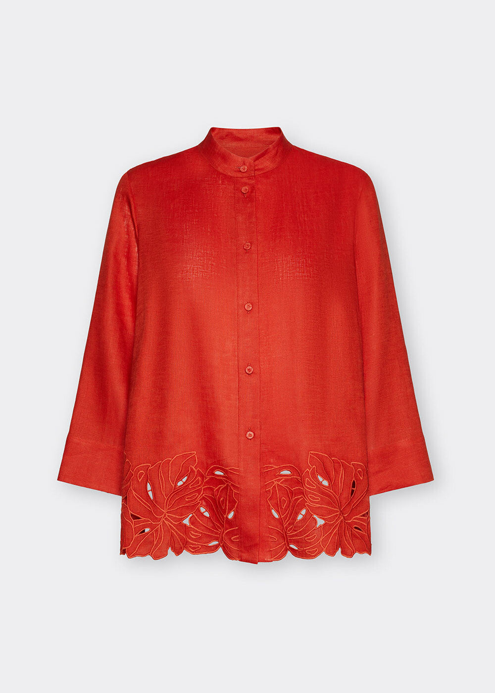Red blouse with floral lace details on a white background