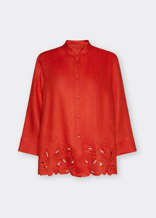Red blouse with floral lace details on a white background