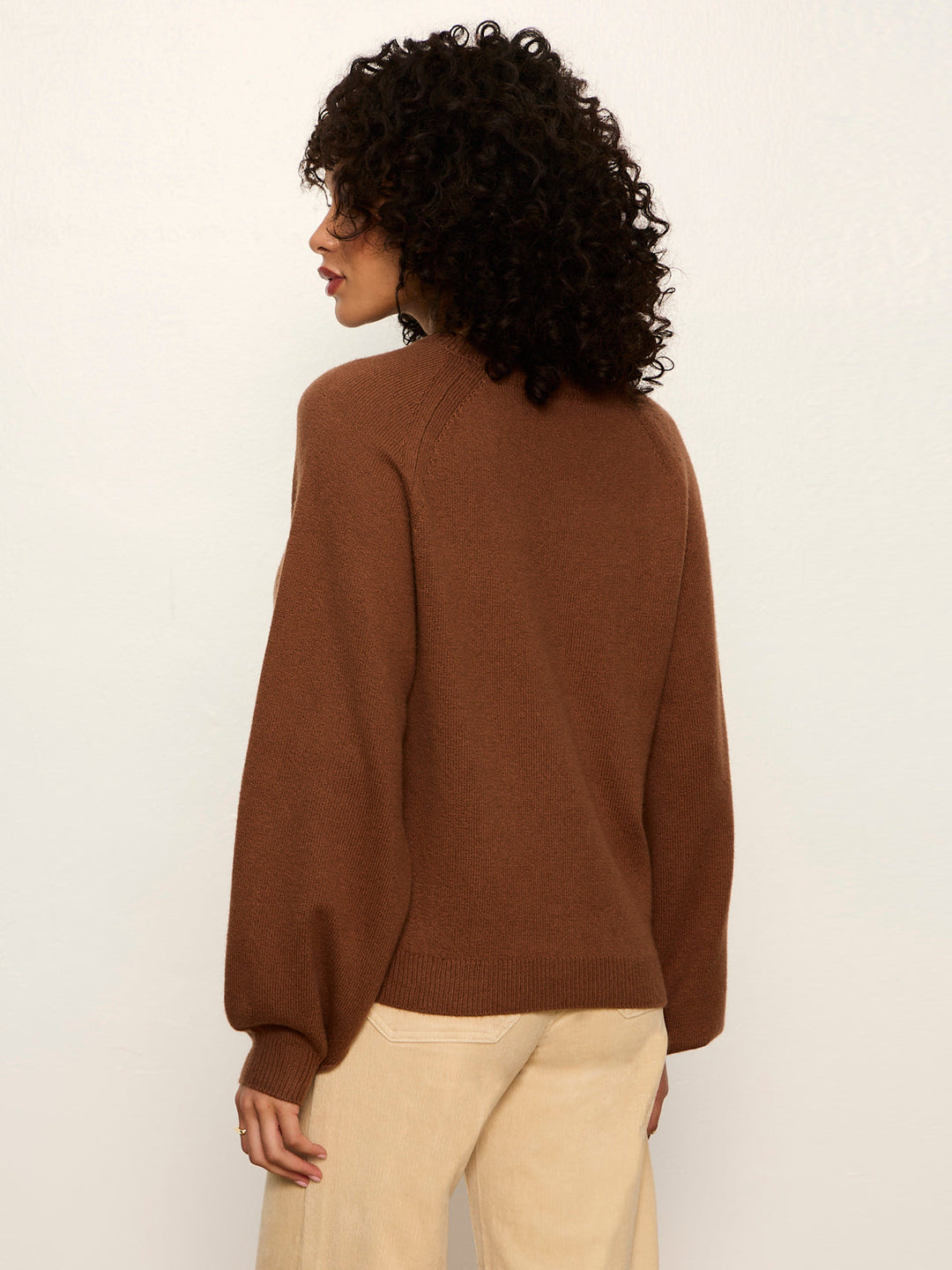 Cocoa brown crewneck knit sweater shown from back, long sleeves and ribbed hem