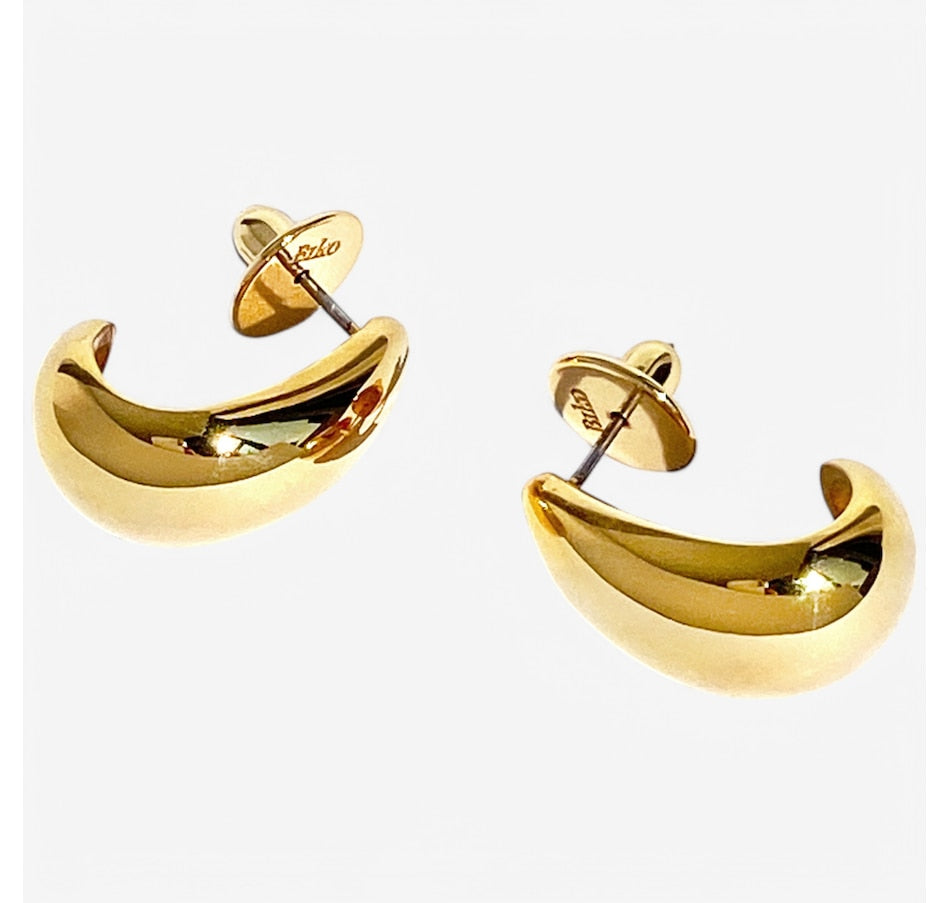 Small curved hoop earrings in gold finish with post backs displayed on white background