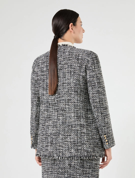 Black and white tweed jacket, back view, gold-tone buttons and frayed hem