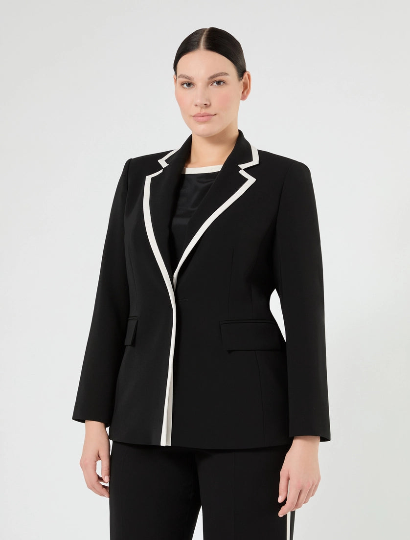 Black blazer with white contrast trim, notch lapels, and front welt pocket
