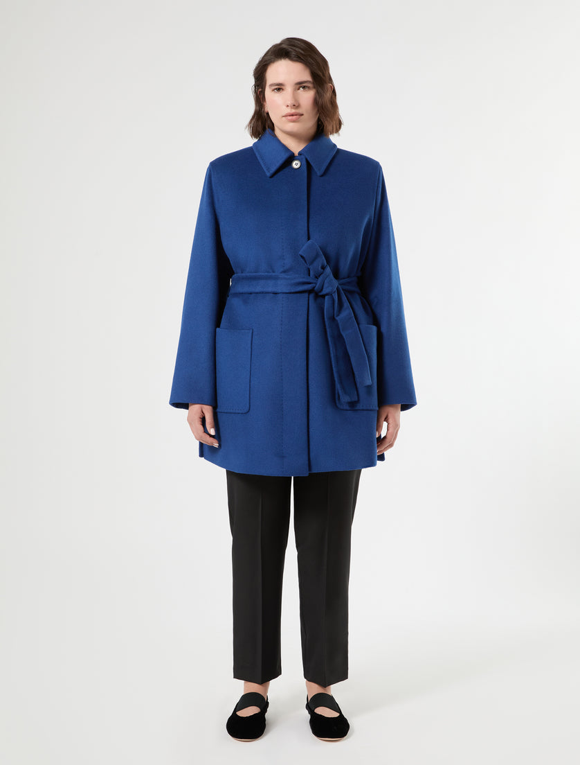 Short wool coat in bright blue with self-tie belt, patch pockets, and covered button placket, front view