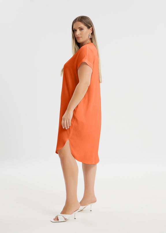 side view of Mat plus size polyester textured air-wash V-neck Short Sleeve Dress in coral