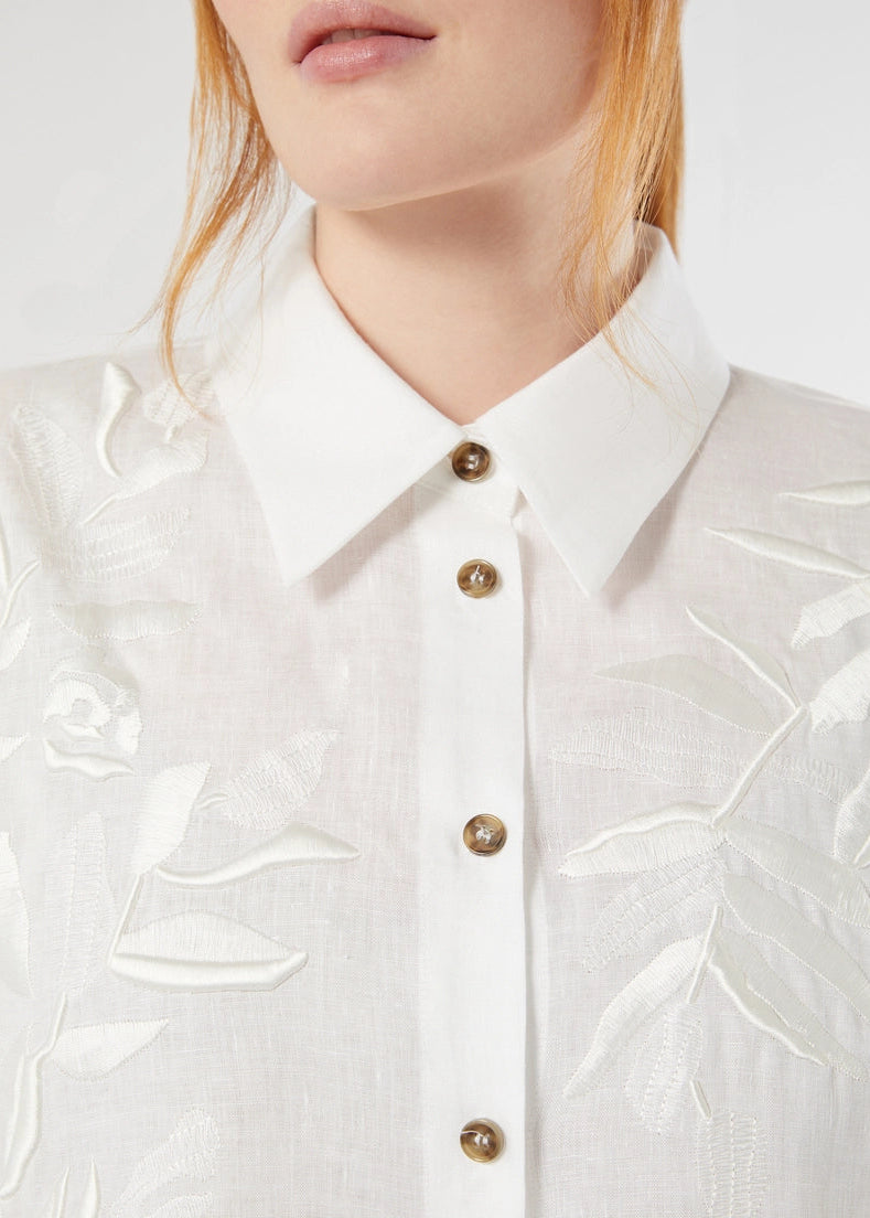 close up front view of plus size Marina Rinaldi Grembo Embellished Linen Long Shirt in Optical White