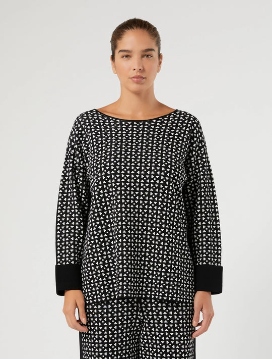 Black-and-white patterned viscose tunic with black cuffs and relaxed round neck