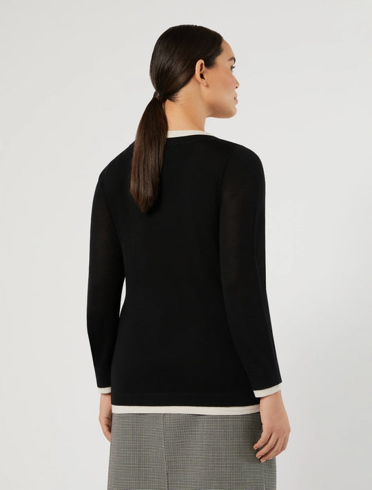 Black long-sleeve crew neck pullover with white trim at cuffs and hem