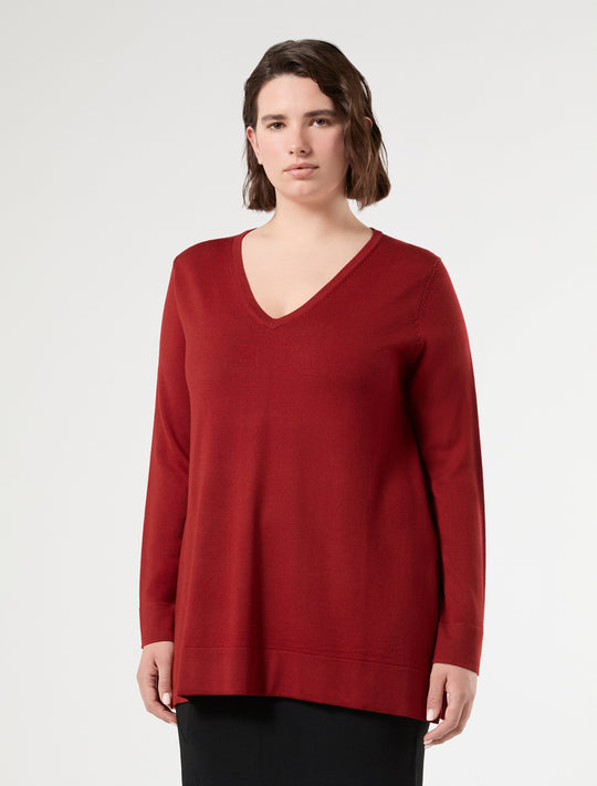 Deep red V-neck long sleeve knit sweater, relaxed fit, worn by model, front view