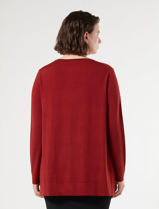 Long sleeve red knit sweater back view on model, relaxed fit with ribbed hem