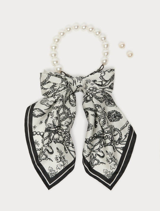 Pearl choker necklace with black and white printed silk bow and matching pearl stud earring