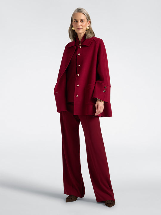 Red double-face coat on model with button front and deep pockets