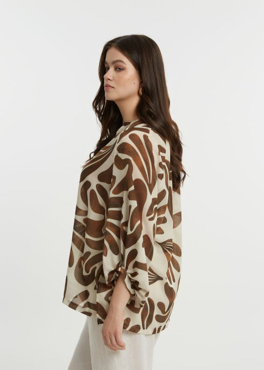 side view of plus size Mat Print Blouse with Split Neck in Caramel