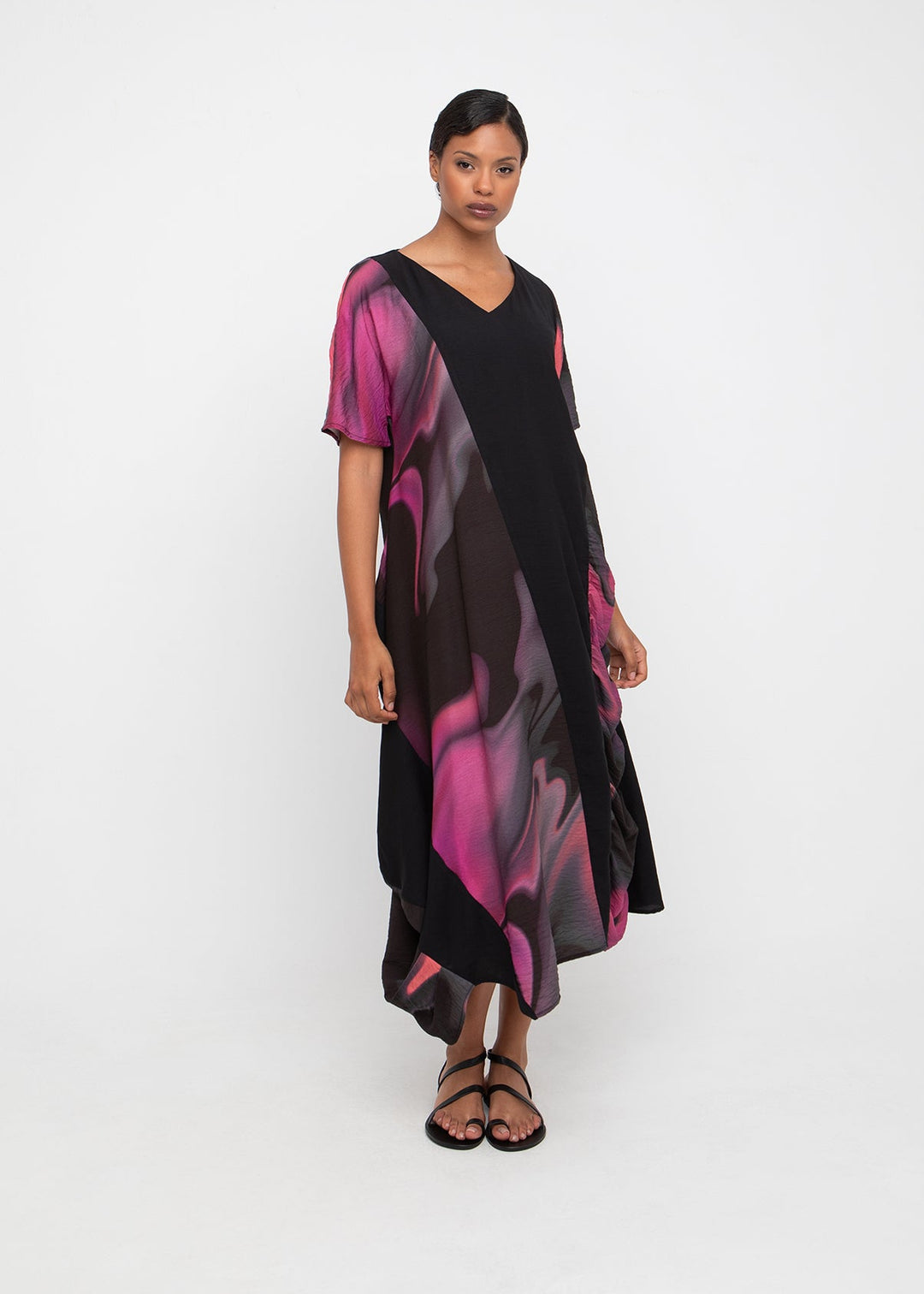 Front view of plus size Ozai N Ku V Neck Asymmetrical Long Pink Print Dress with Short Sleeve in Rose