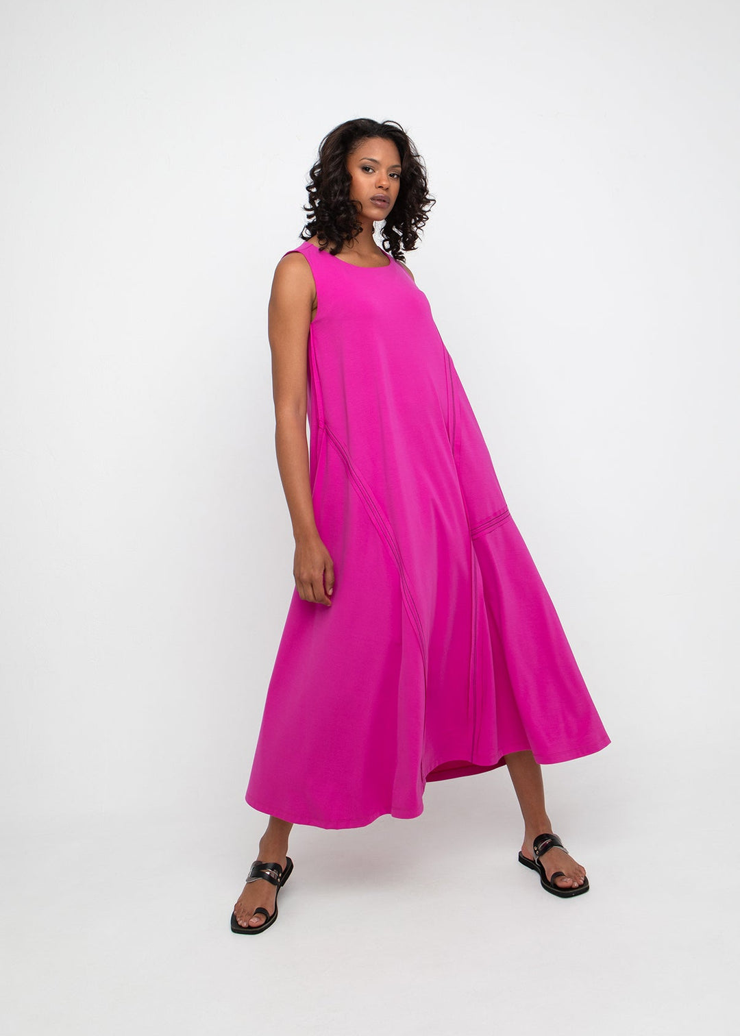 front view of plus size Ozai N Ku Sleeveless Jersey Dress with Asymmetrical Contrast Stitching in Fuchsia
