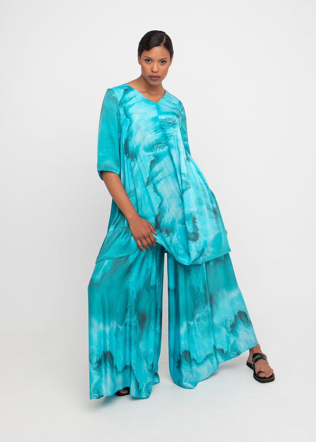 front view of plus size Ozai N Ku V Neck Water Print Elbow Sleeve Drape Hem Tunic in Seafoam