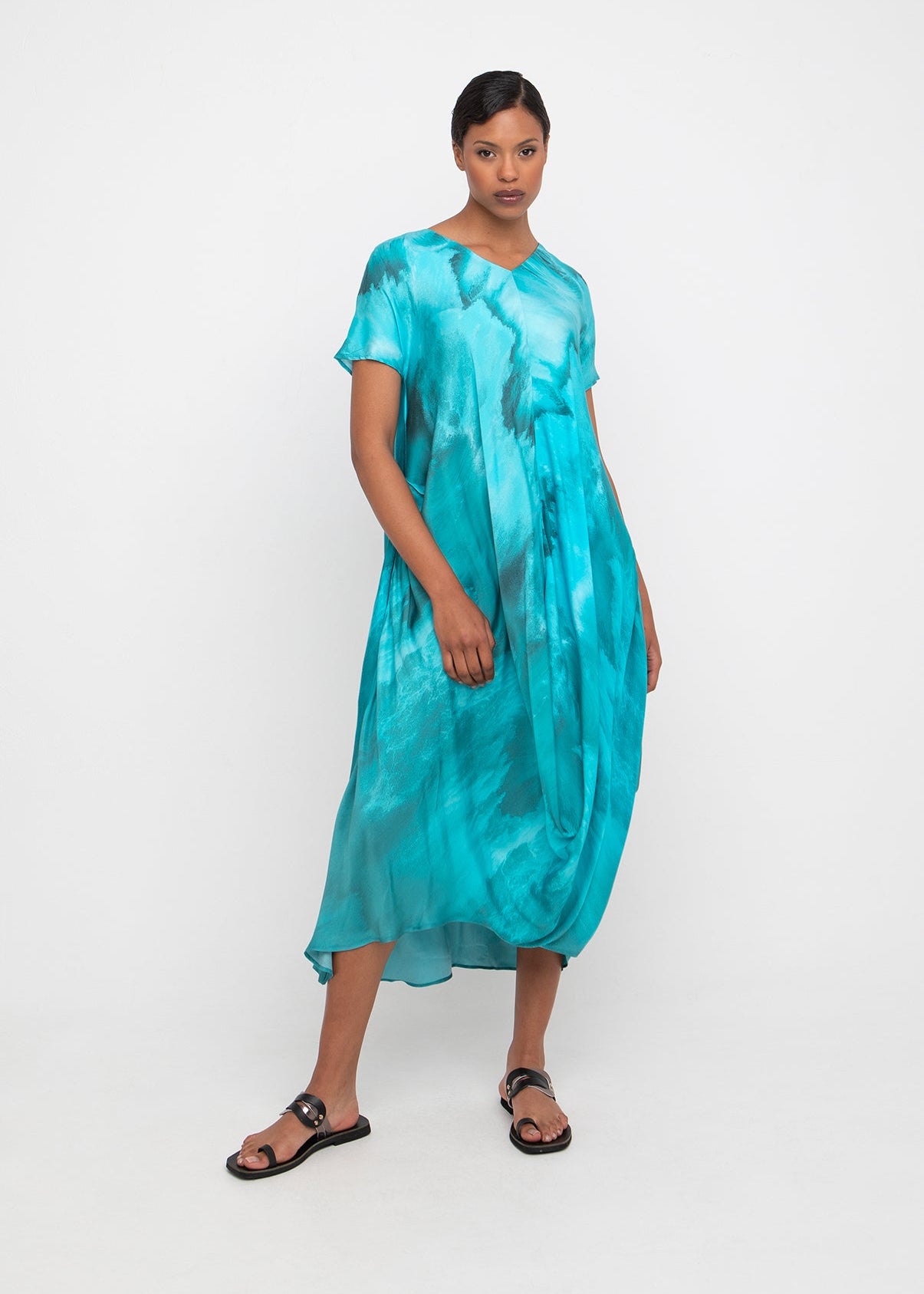 front view of plus size Ozai N Ku V Neck Water Print Short Sleeve Dress with Drape Hem in Seafoam