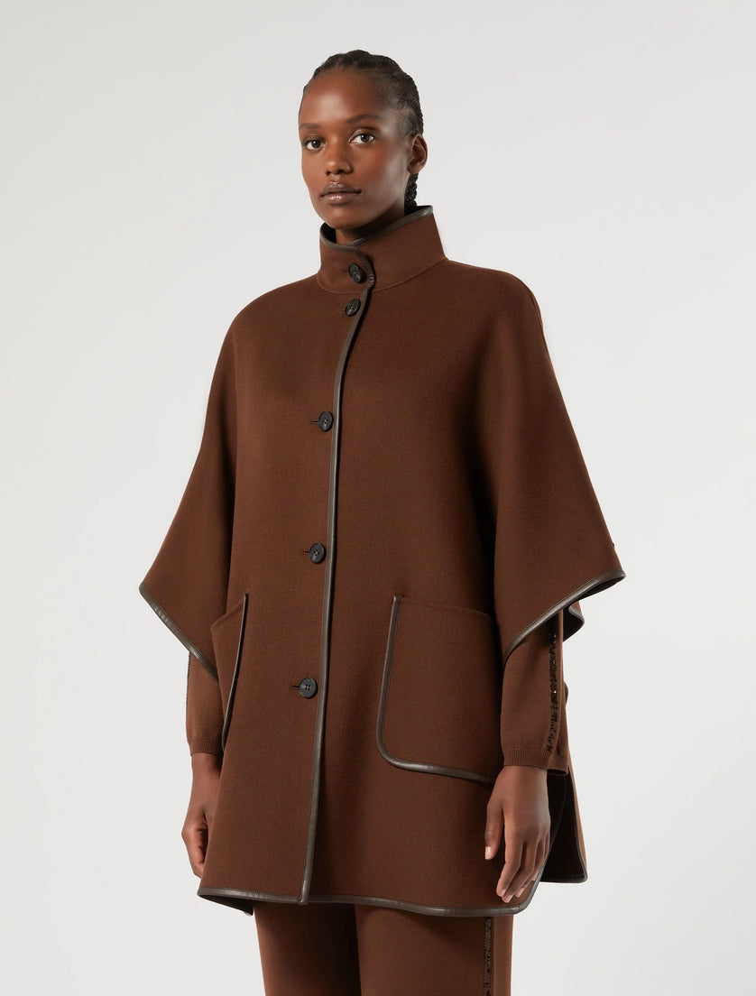 Biscuit faux leather topped cape with stand collar, button placket, flap pockets