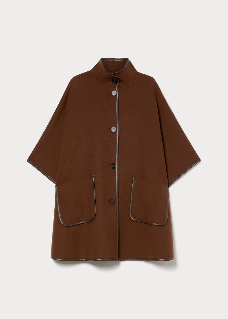 Flat biscuit faux leather topped cape with stand collar, button front, flap pockets
