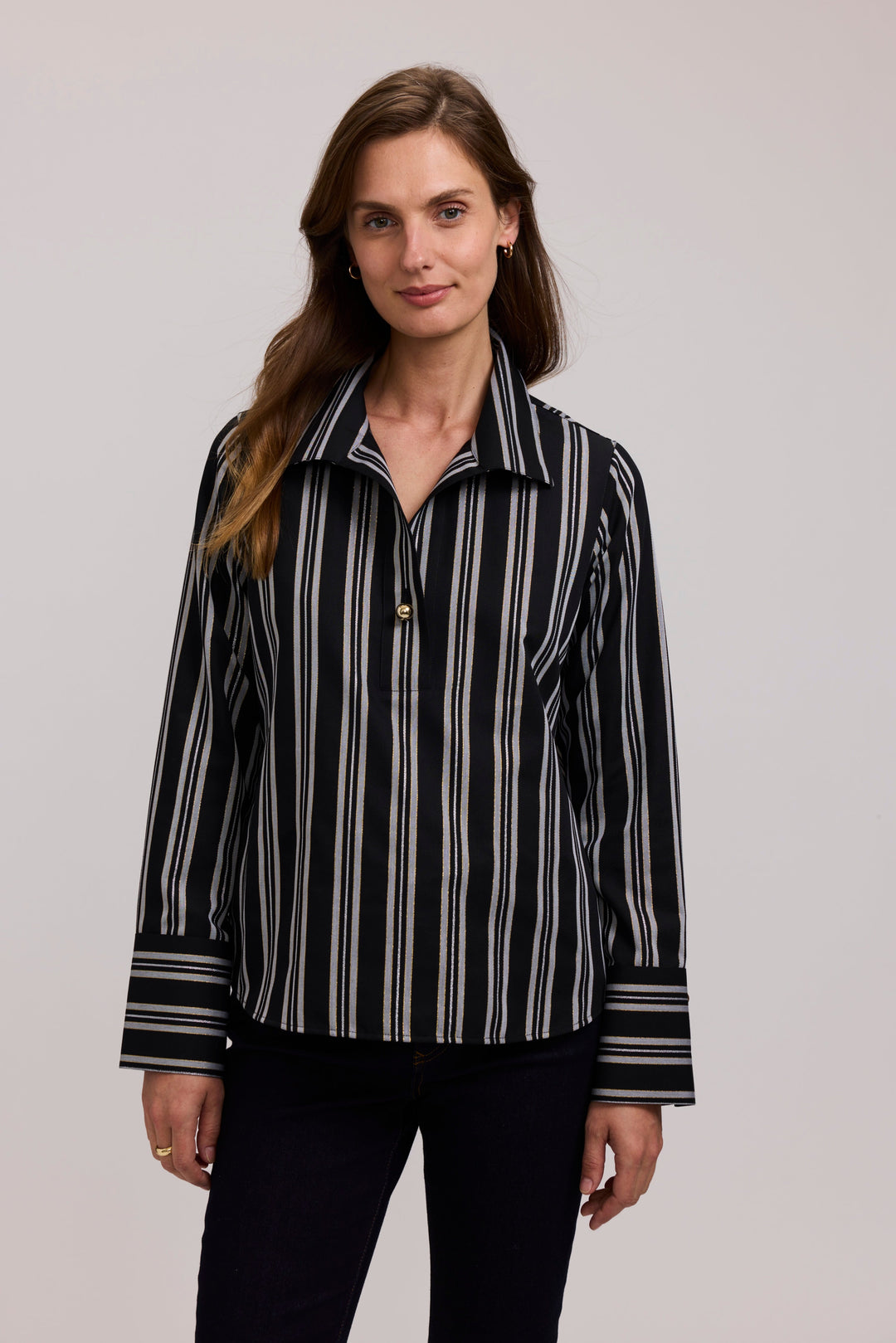 Black-and-white striped long-sleeve popover shirt with pointed collar and button placket