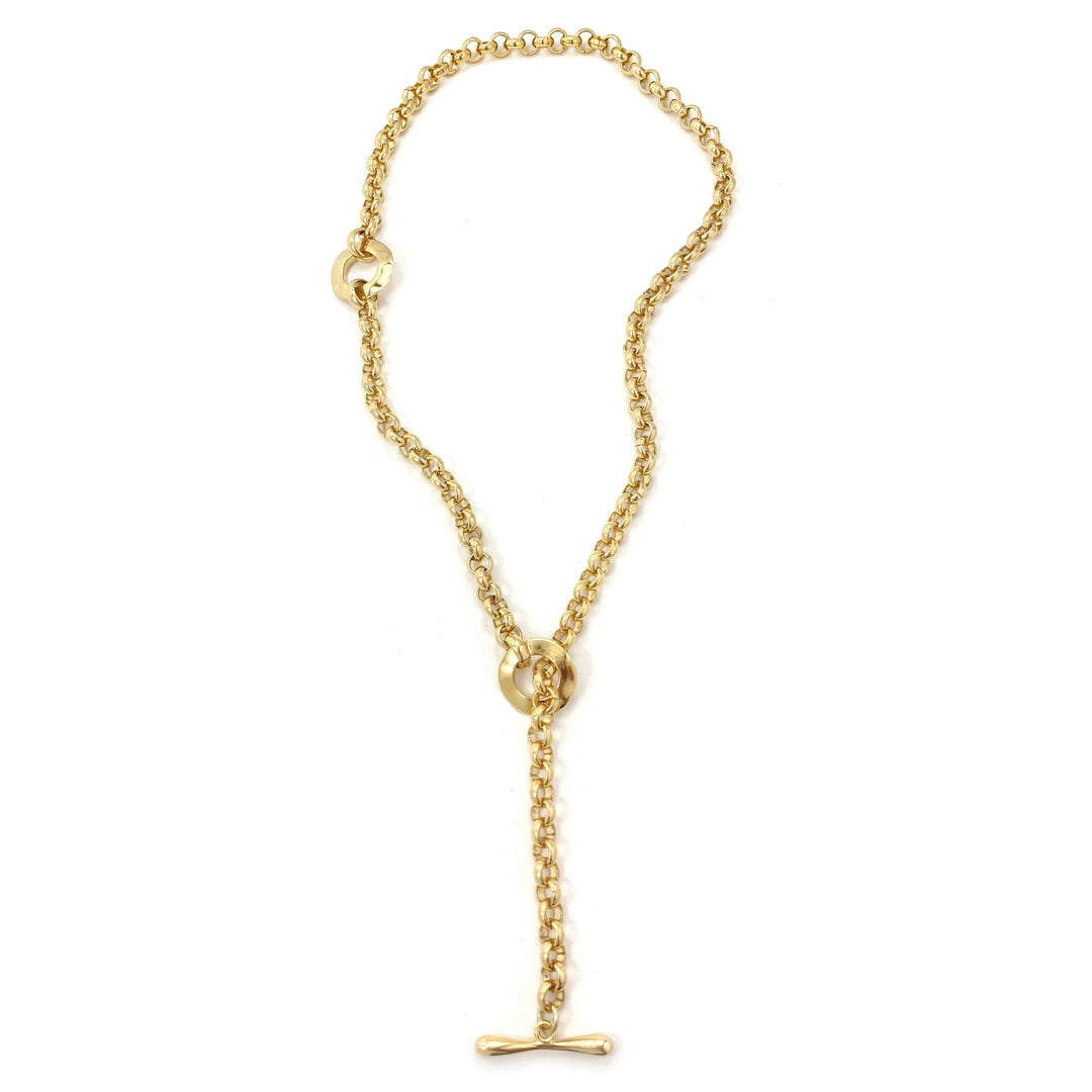 Gold chain convertible lariat necklace with toggle clasp laid flat on white background