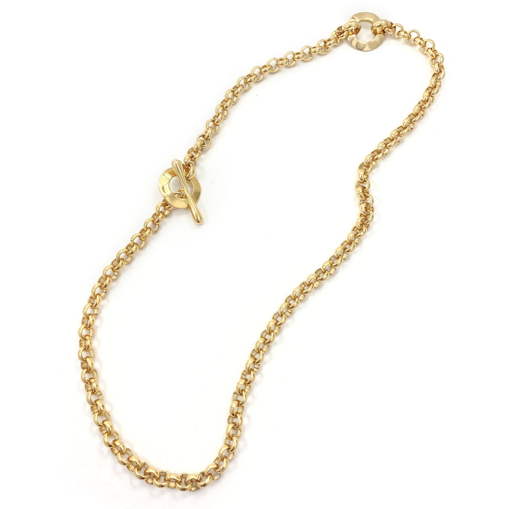 Gold chain necklace with toggle clasp closure laid flat on white background