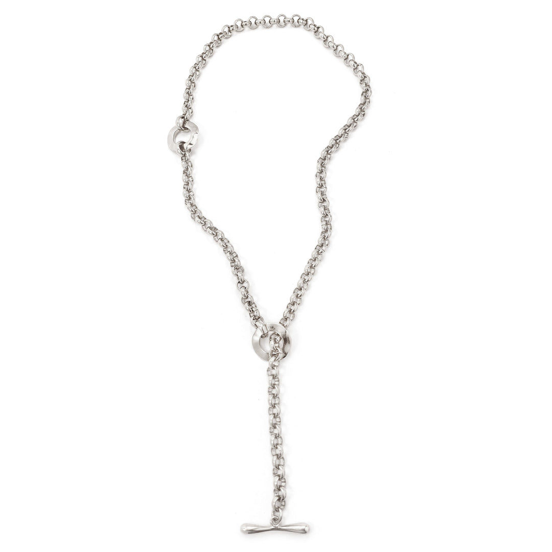 Silver chain lariat necklace with toggle clasp laid flat on white background