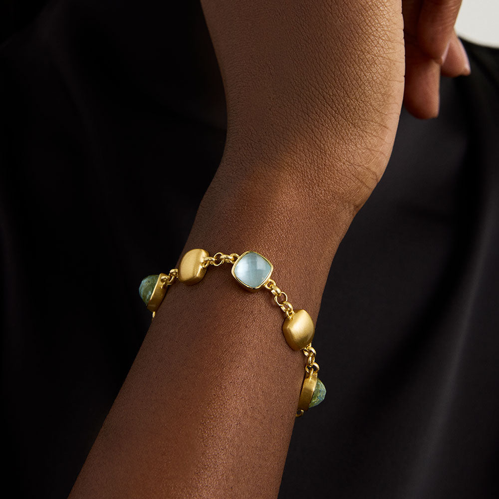 Gold-tone bracelet with light-blue iridescent cube beads and chunky chain links