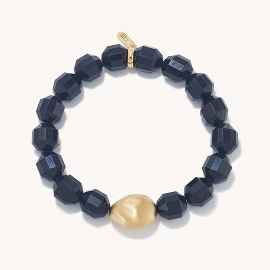Black beaded bracelet with faceted cubes and gold teardrop charm
