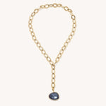 Gold-tone chain necklace with small dark-blue round pendant drop