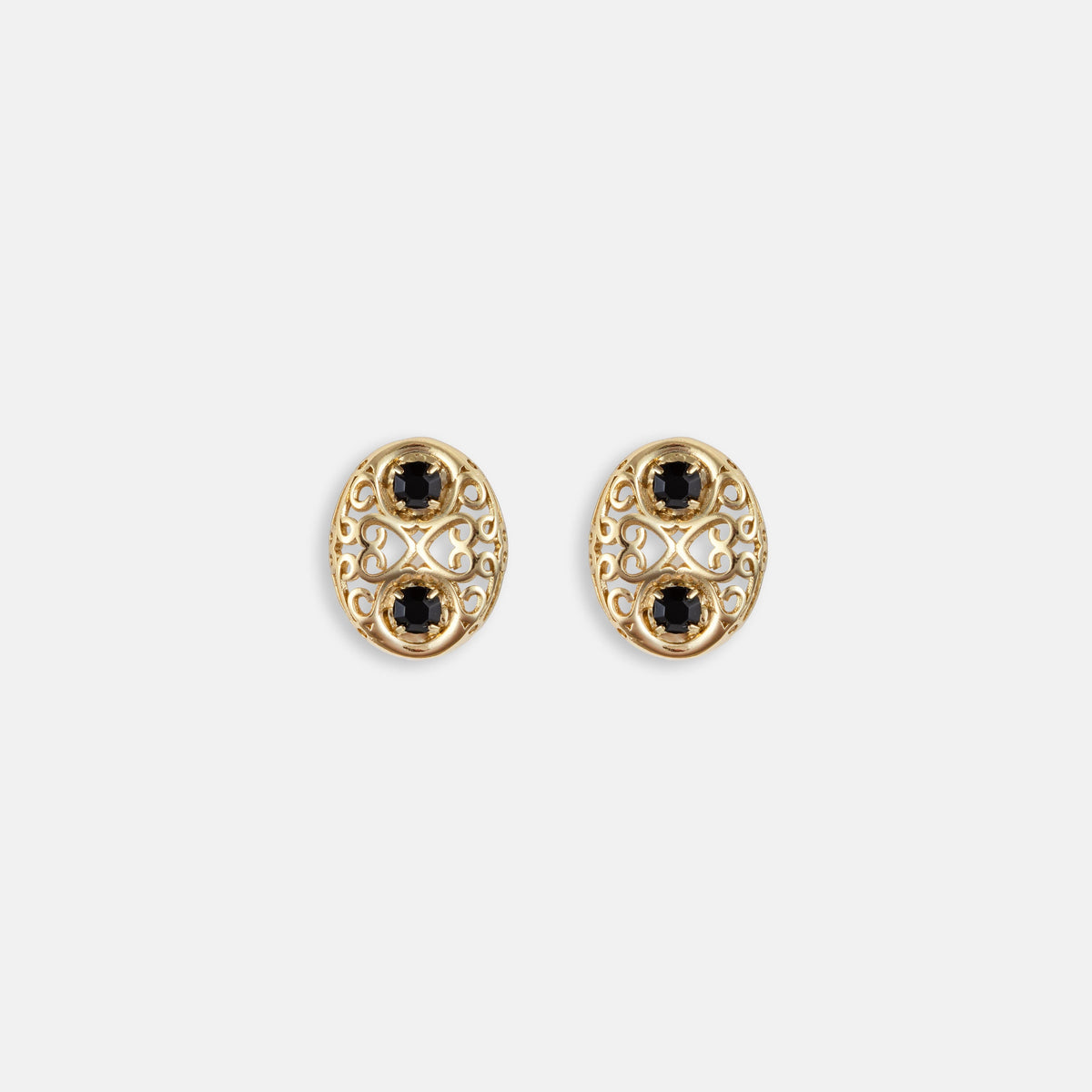 Gold and black jet oval stud earrings with ornate filigree bezel