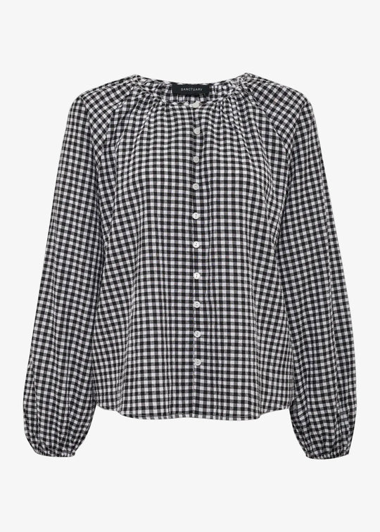 Black and white checkered blouse on a white background