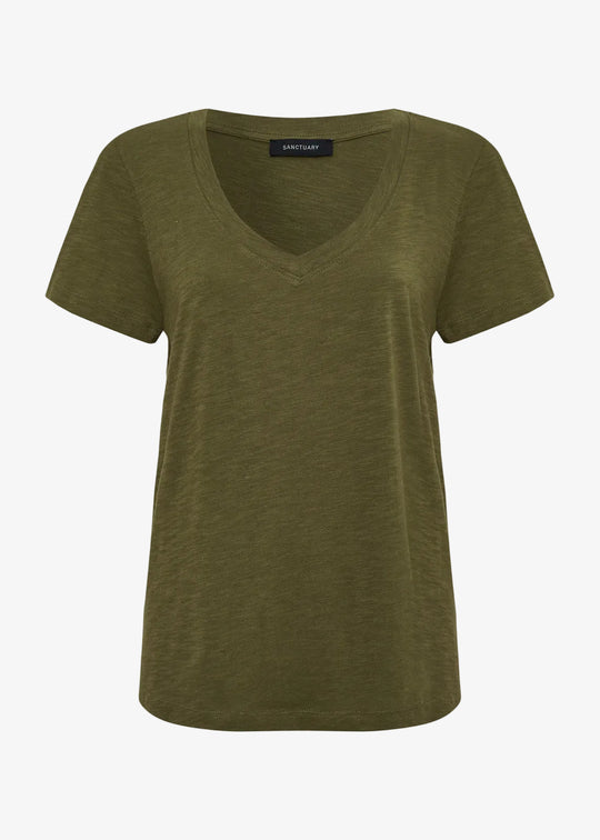 Green t-shirt with a visible brand label on a white background