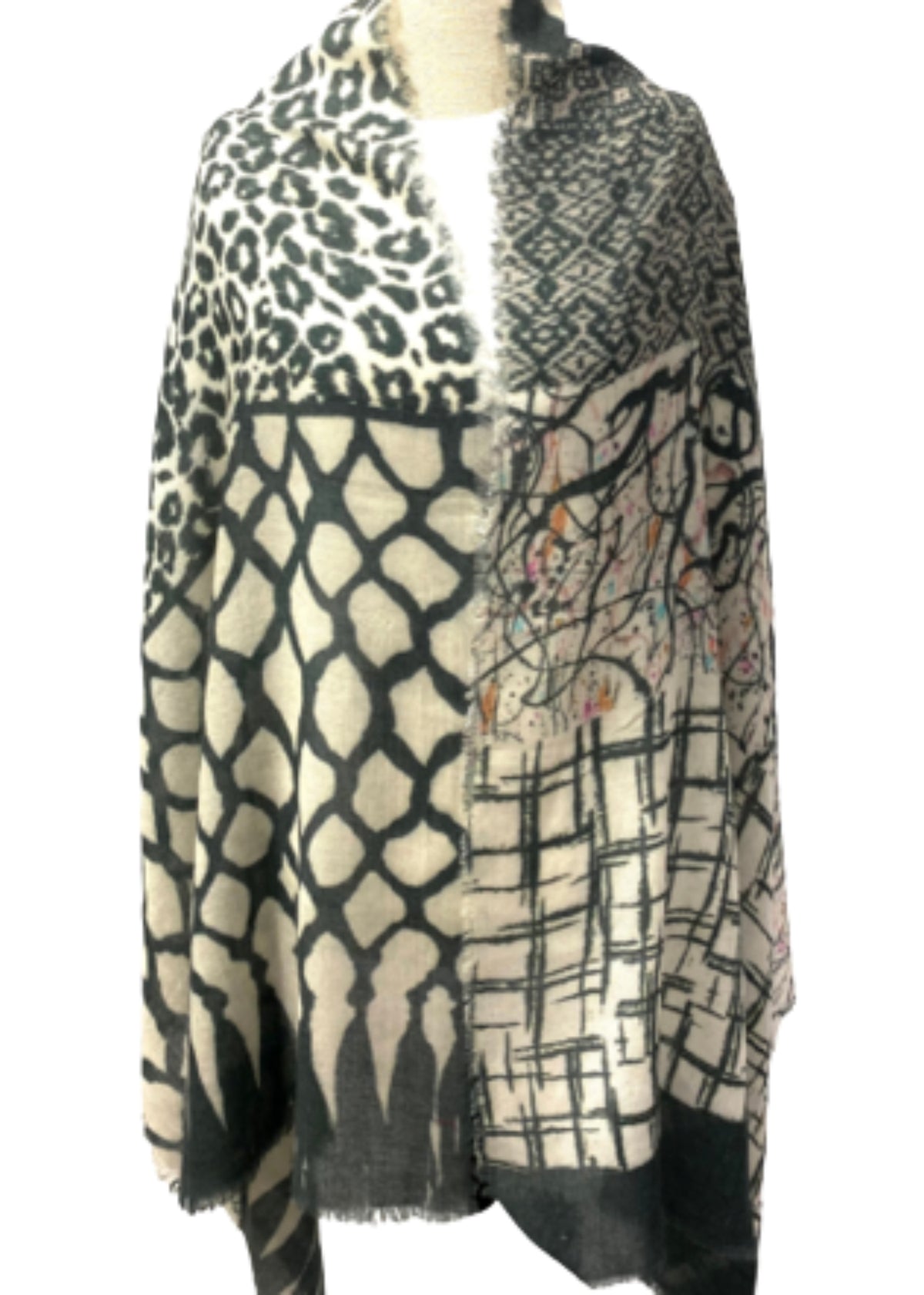 Black and white wool-silk scarf with fringe, bold mixed patterns and abstract motifs